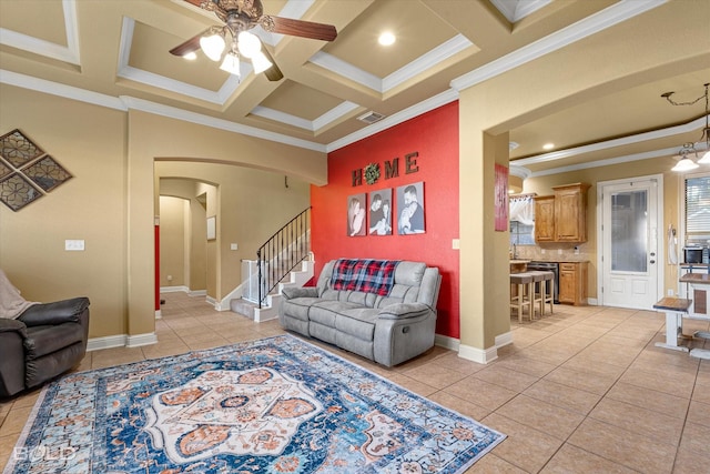 living room with ornamental molding, coffered ceiling, light tile patterned floors, and beam ceiling