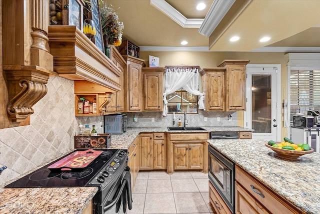 kitchen with built in microwave, sink, ornamental molding, black range with electric stovetop, and light stone countertops