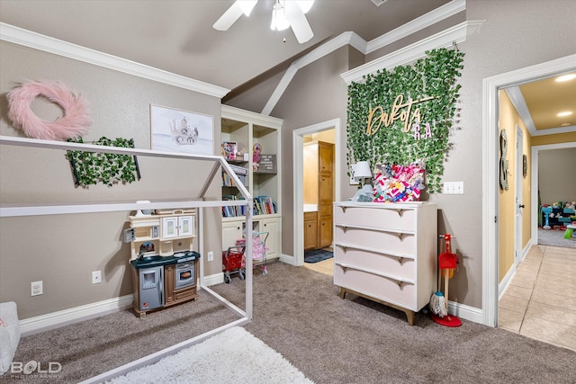 rec room featuring vaulted ceiling, ceiling fan, ornamental molding, and carpet floors