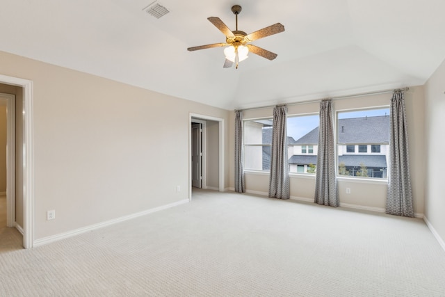 unfurnished room featuring lofted ceiling, light carpet, and ceiling fan