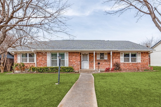 ranch-style home featuring a front yard