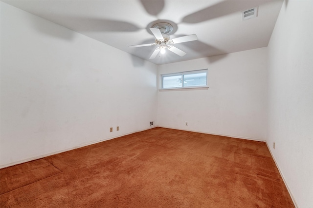 unfurnished room with ceiling fan and carpet flooring