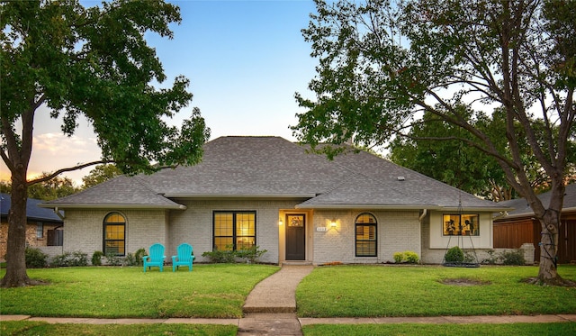 view of front of property with a yard