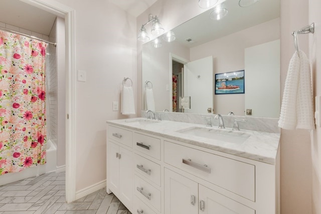 bathroom featuring shower / tub combo with curtain and vanity