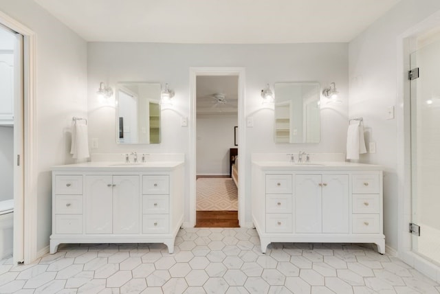 bathroom with vanity, an enclosed shower, and tile patterned flooring