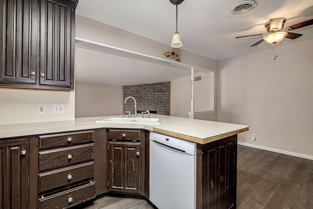 kitchen featuring pendant lighting, sink, white dishwasher, kitchen peninsula, and dark brown cabinets