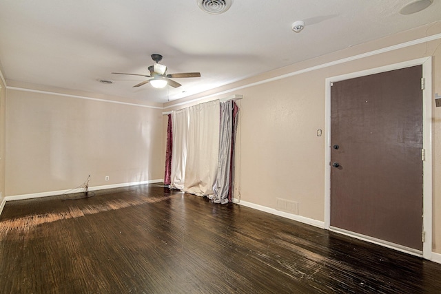 empty room with crown molding, ceiling fan, and wood-type flooring