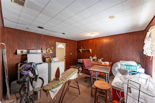 carpeted dining room featuring washer and dryer