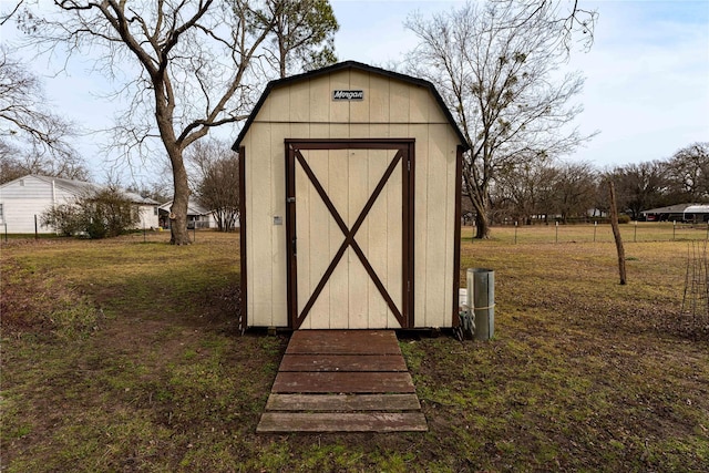 view of outbuilding featuring a lawn