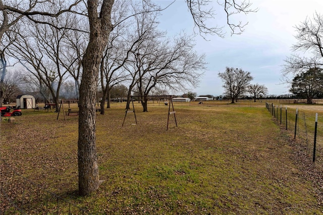 view of yard with a rural view