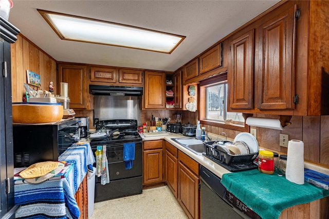 kitchen with sink and black appliances