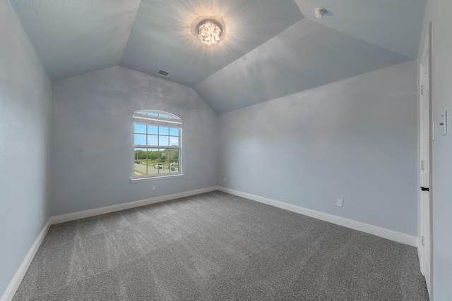 bonus room featuring lofted ceiling and carpet