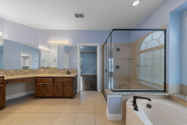 bathroom with vanity, shower with separate bathtub, and tile patterned flooring