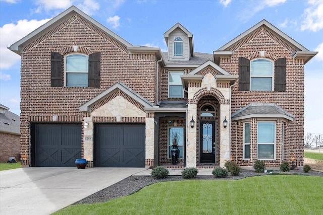 view of front facade featuring a garage and a front yard