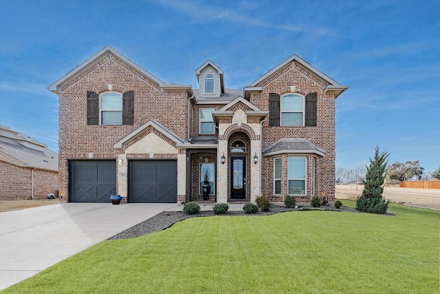 view of front of home featuring a garage and a front yard