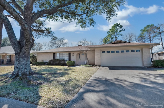 ranch-style home featuring a garage