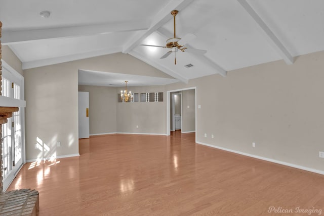 unfurnished living room featuring ceiling fan with notable chandelier, plenty of natural light, light hardwood / wood-style floors, and lofted ceiling with beams