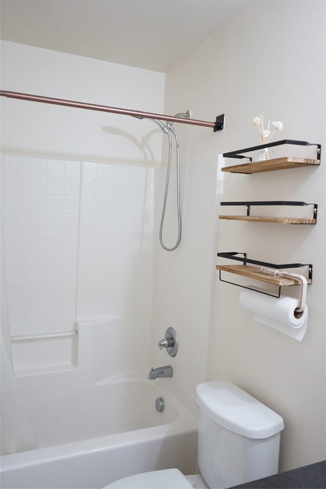 bathroom with toilet and shower / bath combo with shower curtain