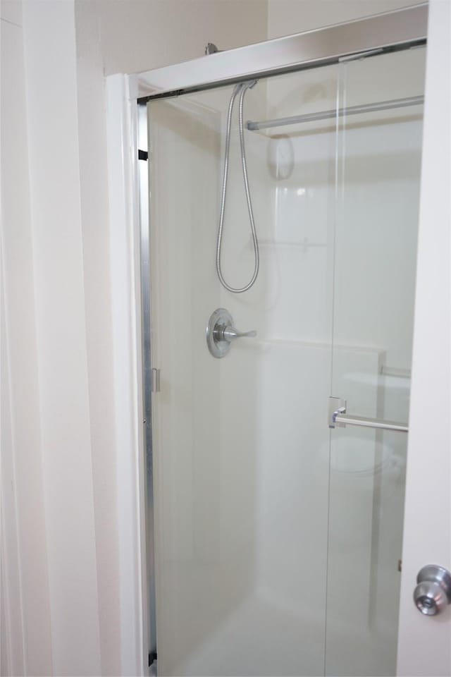 full bathroom with a stall shower