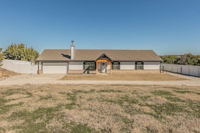 ranch-style house featuring a garage