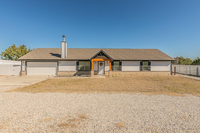 ranch-style house featuring a garage