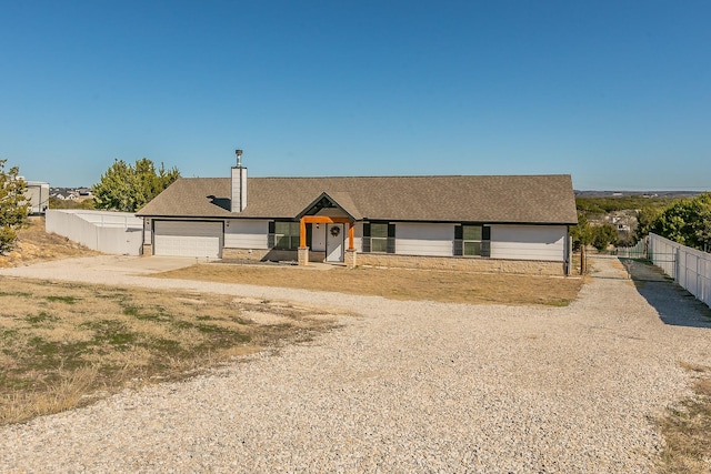 ranch-style house featuring a garage