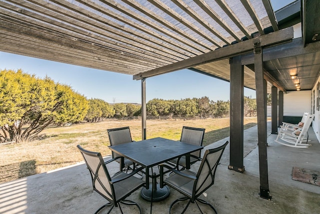 view of patio / terrace with outdoor dining space and a pergola