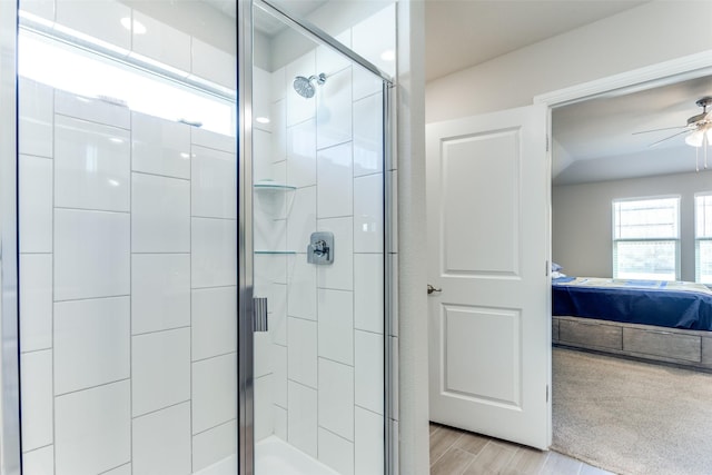 bathroom featuring ceiling fan and walk in shower