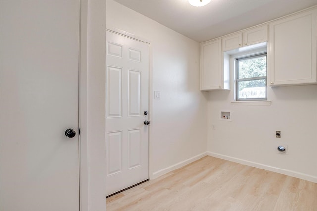 clothes washing area with cabinets, hookup for an electric dryer, hookup for a washing machine, and light hardwood / wood-style flooring