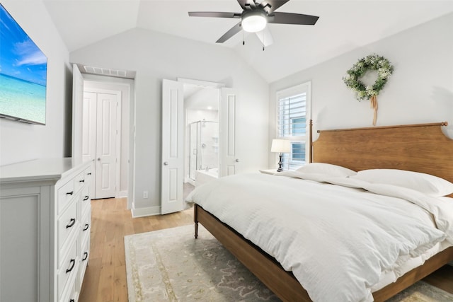 bedroom featuring vaulted ceiling, connected bathroom, ceiling fan, and light hardwood / wood-style floors