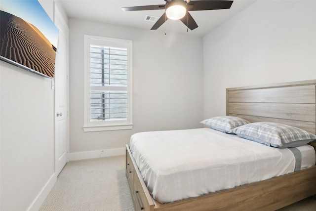 bedroom with light carpet and ceiling fan