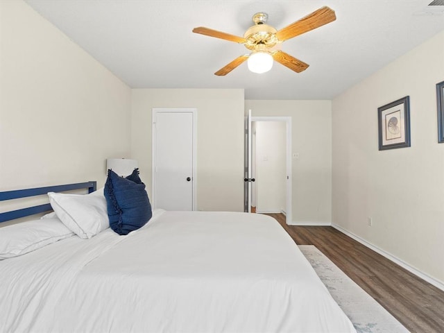 bedroom featuring dark hardwood / wood-style floors and ceiling fan