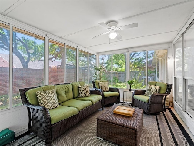 sunroom with a wealth of natural light and ceiling fan