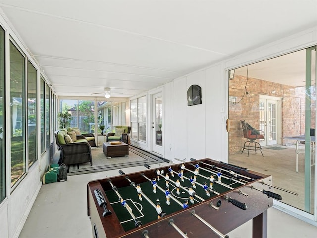 game room featuring concrete flooring