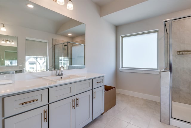 bathroom featuring vanity, an enclosed shower, plenty of natural light, and tile patterned floors