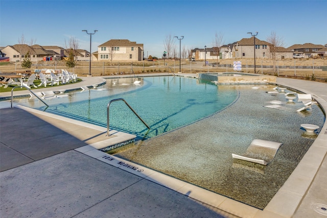 view of pool featuring a patio