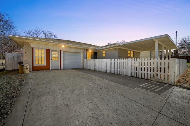 ranch-style home featuring a garage