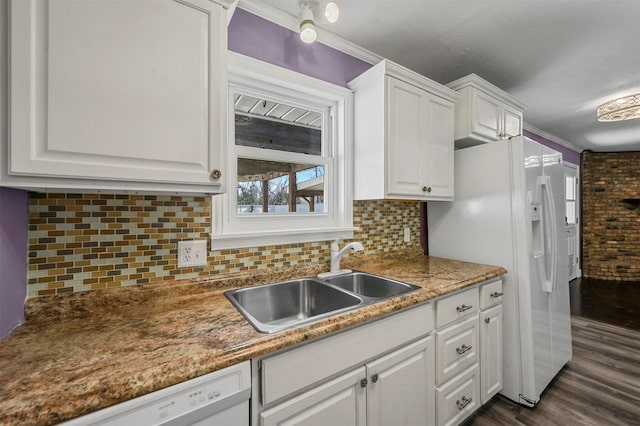 kitchen with white cabinetry, sink, dark hardwood / wood-style flooring, crown molding, and white appliances