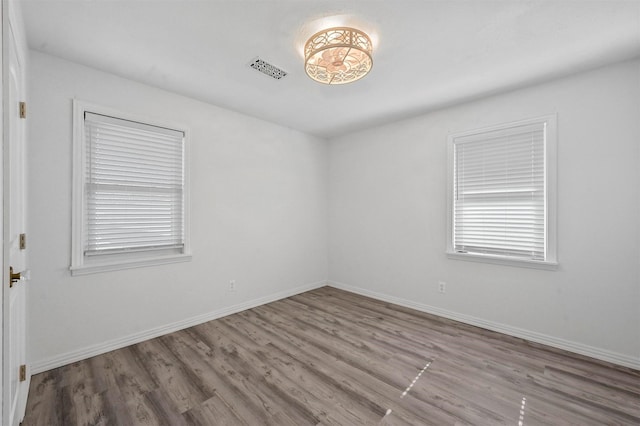 empty room with light hardwood / wood-style floors