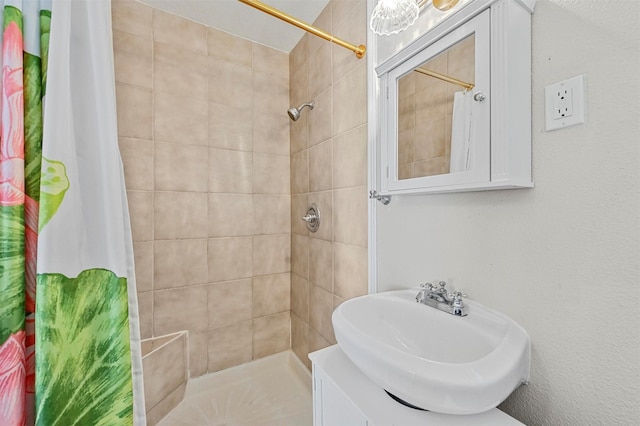 bathroom with sink and walk in shower