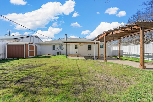 back of house with cooling unit, a yard, a pergola, a patio area, and a storage shed