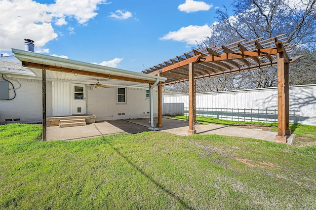 back of house featuring a pergola, a patio area, ceiling fan, and a lawn