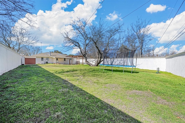 view of yard featuring a trampoline