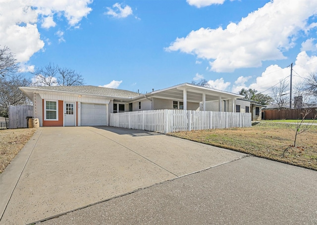 single story home with a garage and a front yard