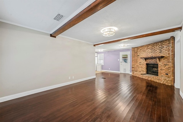 unfurnished living room featuring a brick fireplace, dark wood-type flooring, ornamental molding, and beamed ceiling