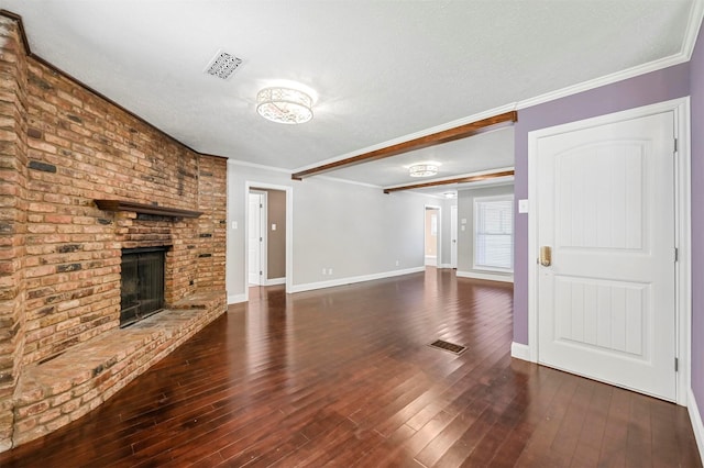 unfurnished living room with ornamental molding, dark hardwood / wood-style floors, and a fireplace