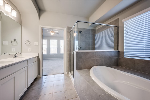 bathroom with ceiling fan, vanity, shower with separate bathtub, and tile patterned flooring