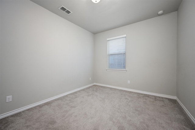 unfurnished room with light colored carpet