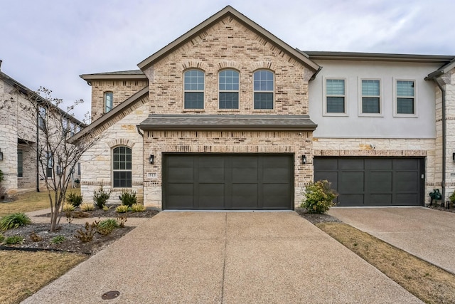 french country home featuring a garage