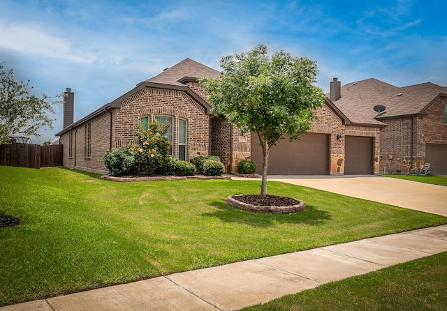 view of front of property with a garage and a front lawn